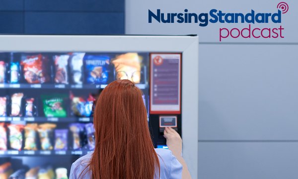 Picture shows a woman inserting coins into a vending machine containing snacks