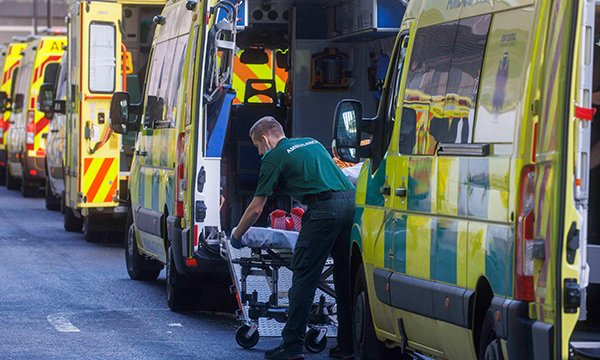 Ambulances queue outside a hospital emergency department