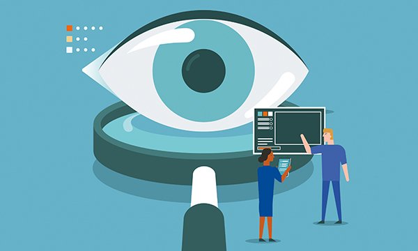 Two nurses working with a non-contact monitoring tool. An eye and magnifying glass are in the background, to highlight the technology is being used to observe patients.