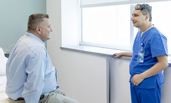 Wegovy (semaglutide) and Mounjaro (tirzepatide) are prescription drugs that may be used in the management of weight loss and is available for certain patients. Picture shows an overweight man in consultation with an NHS nurse