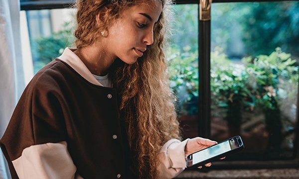 Stress and loneliness: exploring adolescents’ use of social media as a coping strategy during COVID-19