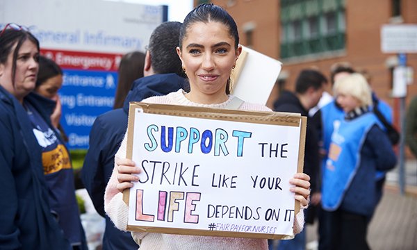 Photo of nurses striking outside Leeds General Infirmary; many staff in England in outsourced NHS services may miss out on pay rise
