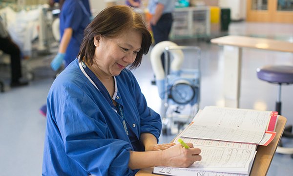 Ward nurse making notes