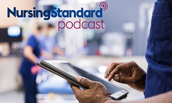 Photo of nurse checking patient data on a tablet, which can inform a care decision