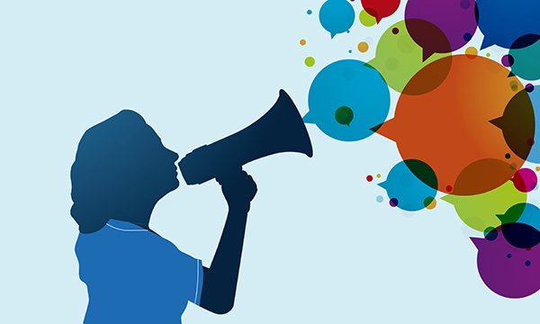 Illustration of a nurse speaking into a loudhailer with speech bubbles coming out: nurses must feel able to speak up and raise concerns