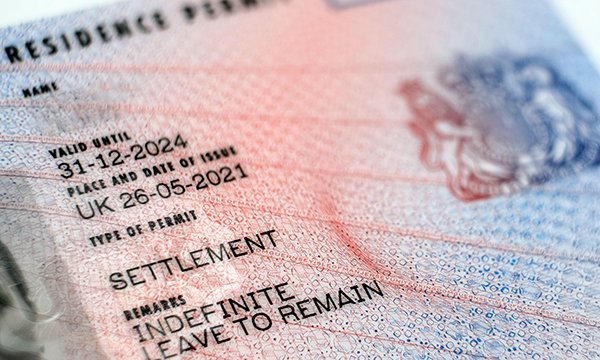 Close-up of a passport visa with proof of an indefinite leave to remain