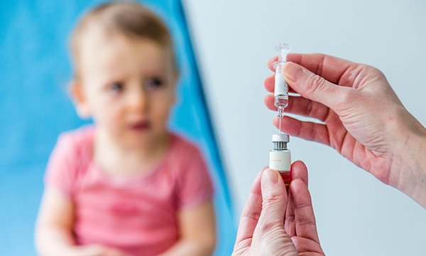 Photo of young child receiving a vaccine, illustrating a story about the chickenpox vaccine