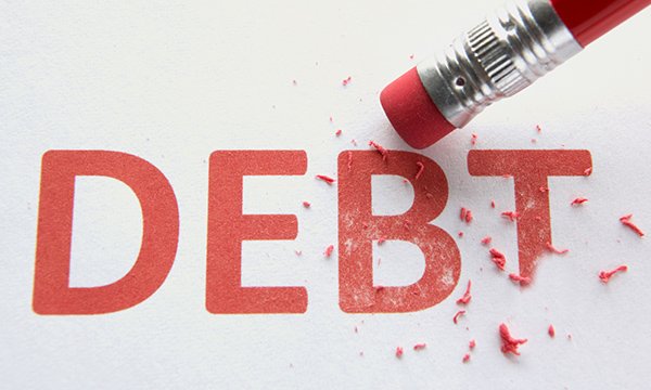 Picture shows the word 'debt' in red letters being rubbed out by an eraser on the tip of a pencil