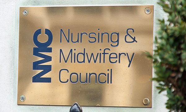 Brass name plate outside NMC building