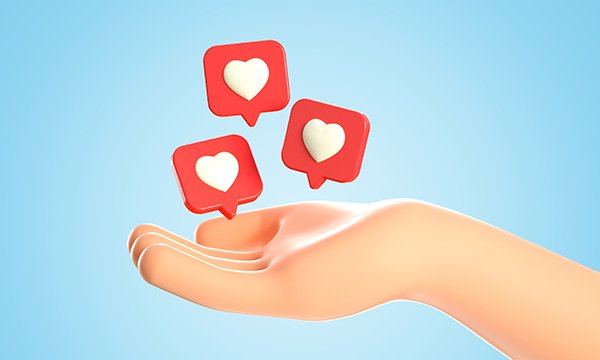 Illustration showing an outstretched hand catching three floating squares bearing a heart design, suggesting a show of appreciation