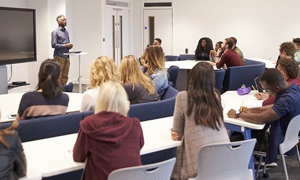 Academic clinicians: not every nurse has been an academic, but it often feels like every academic has been a nurse – picture shows students taking notes in a lecture hall