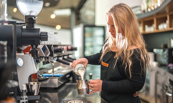 Newly qualified nurses are having to seek employment elsewhere to make ends meet, such as in coffee shops or in retail. Picture shows a female barista making coffee