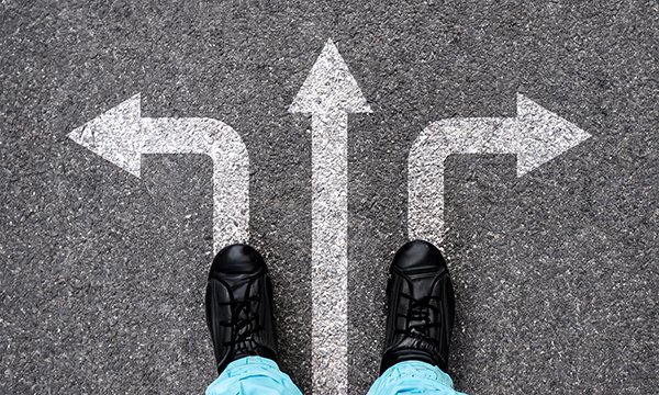 Moving sideways in nursing: nurse stands at junction of three arrows pointing in different directions