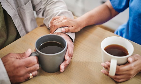Caffeine reduction trial: two people drinking coffee