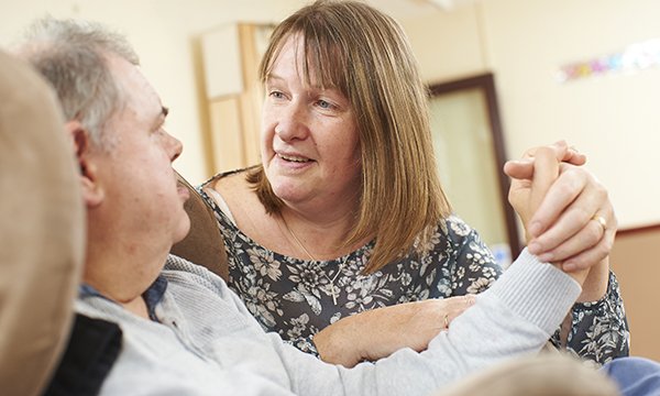 The RCN Foundation recently hired researchers from the London School of Economics to examine what the economic case for learning disability nurses is. A nurse holds the hand of a man with learning disabilities while talking to him