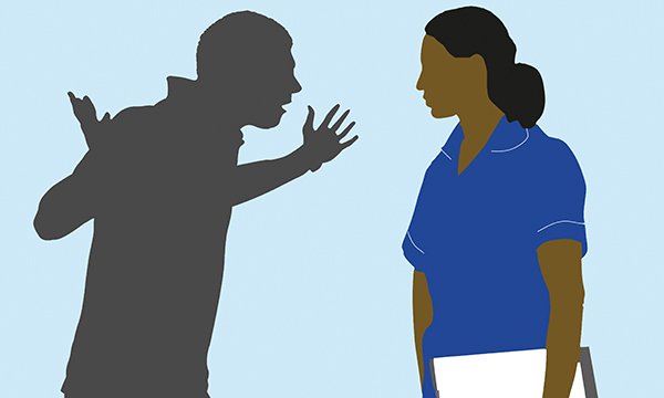 Nurses bullied at work: female nurse shown facing a man drawn in shadow who gesticulates in anger