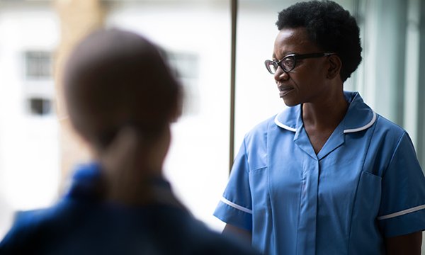 Racial abuse: black nurse with colleague