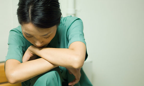 nurse looks downcast