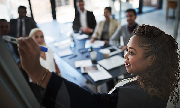 black woman presents to meeting