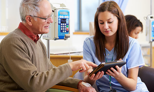 nurse researcher with a patient