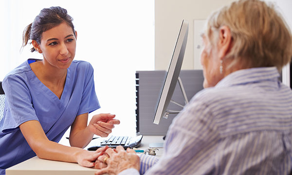 GP nurse with patient