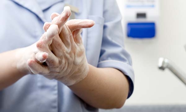 nurse washing her hands