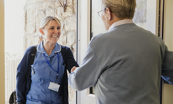 district nurse visits a patient