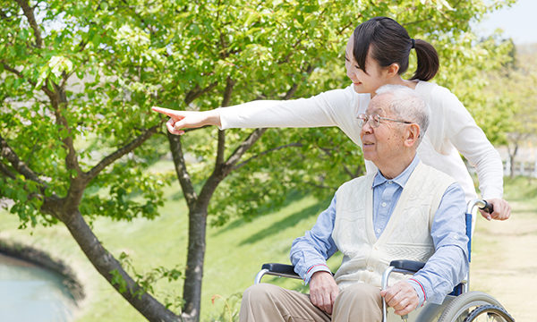 man looking at nature with support of carer