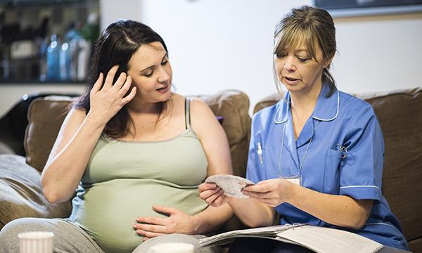pregnant woman and midwife