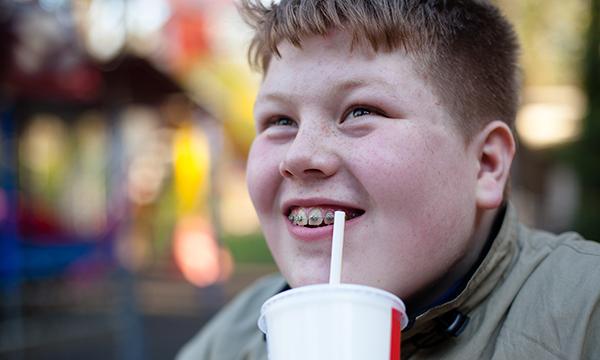 Child with sugary drink