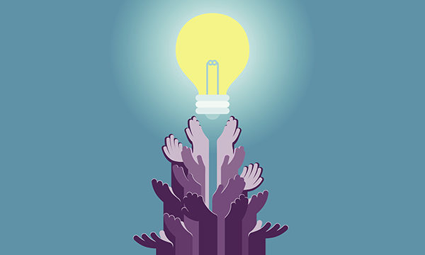 Diverse hands lead up to light bulb