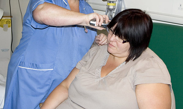 Obese nurse cares for obese patient