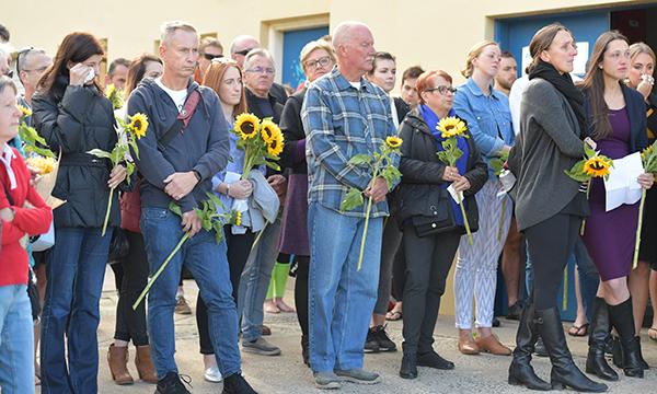 mourners with sunflowers