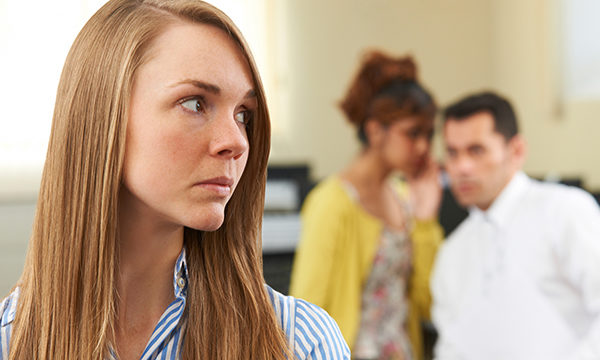 woman notices people whispering