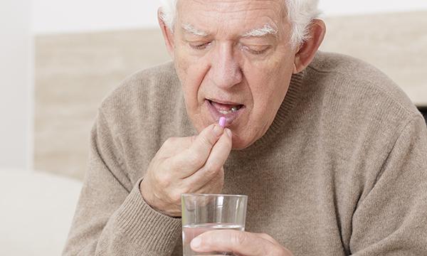 Senior taking a tablet