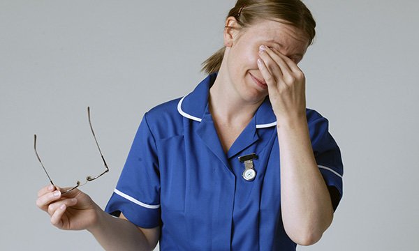 Photograph of tired nurse