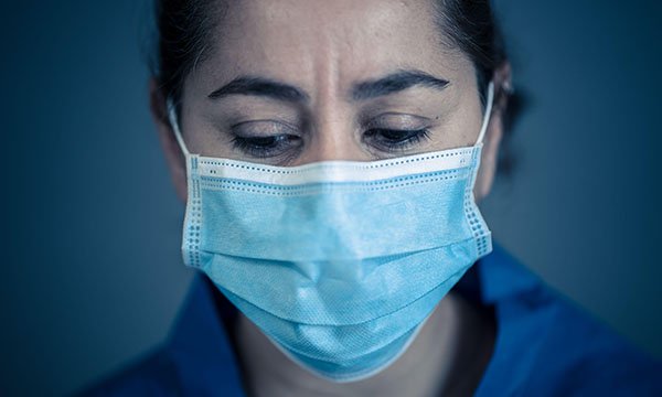 Picture of a female medic wearing a mask